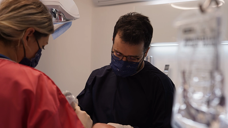 Dr. Dt. Onur Utku Yüksel during treatment at Soho Dental Clinic