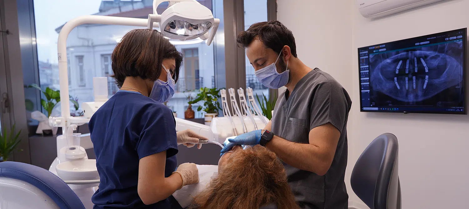 Dt. Ufuk Ağdaşan during treatment at Soho Dental Clinic